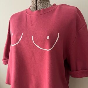 Pink Graphic cutout sweatshirt. Boob impression